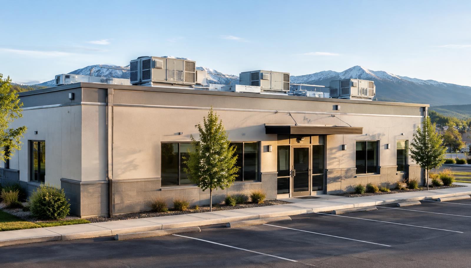 A small Colorado commercial building with rooftop HVAC units visible